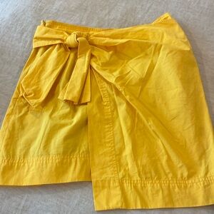 Very cute slicker yellow mini skirt